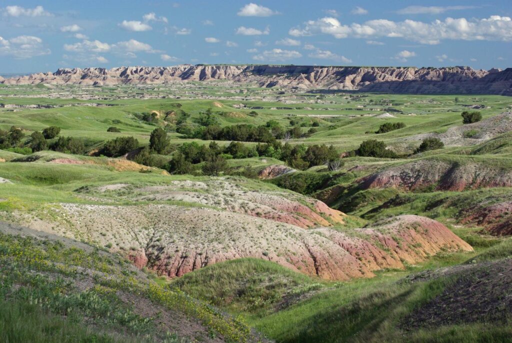 Exploring the rugged beauty of Badlands South Dakota on a thrilling camping adventure.