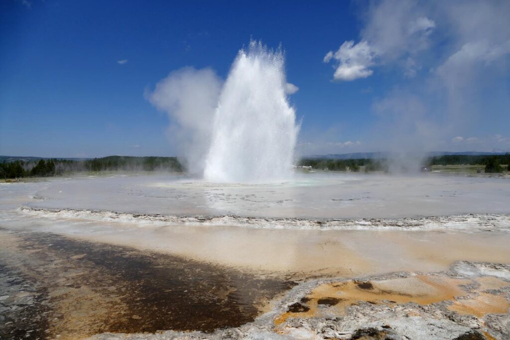 Spectacular Yellowstone National Park geyser, enhancing the camping adventure with natural wonders.